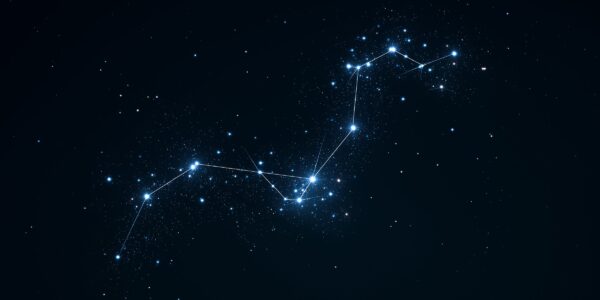 A constellation of bright stars connected by lines against a dark night sky, surrounded by smaller stars. The scene is serene and cosmic.